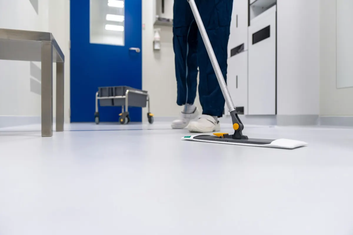 Cleaner mopping a floor